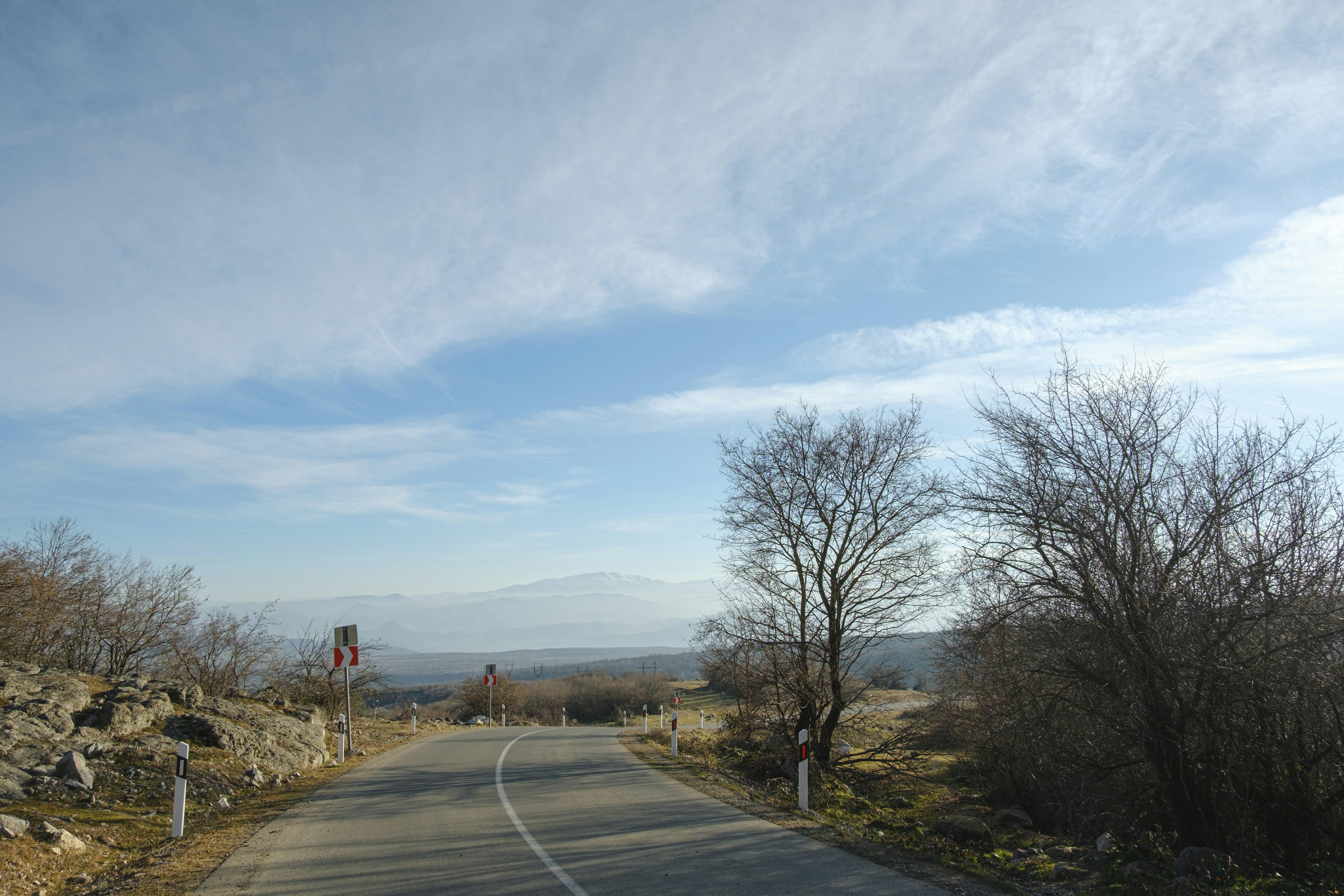 a road with a stop sign on the side of it