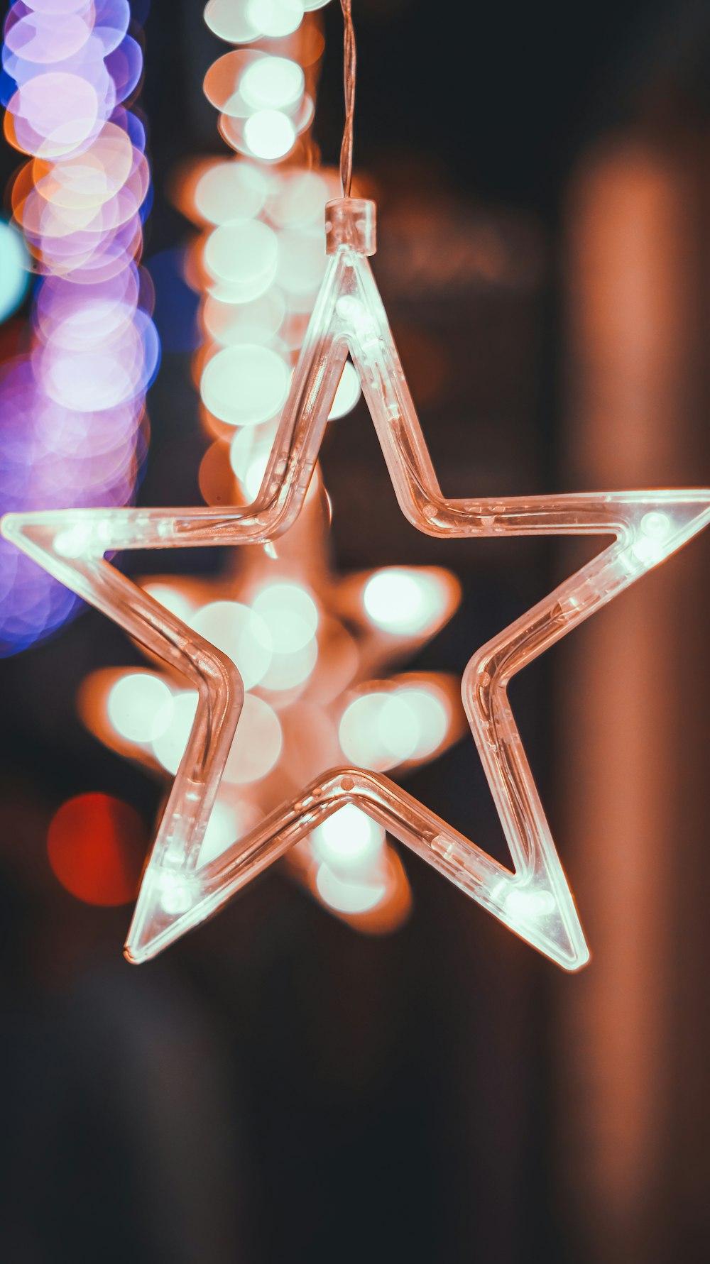 a star ornament hanging from a string