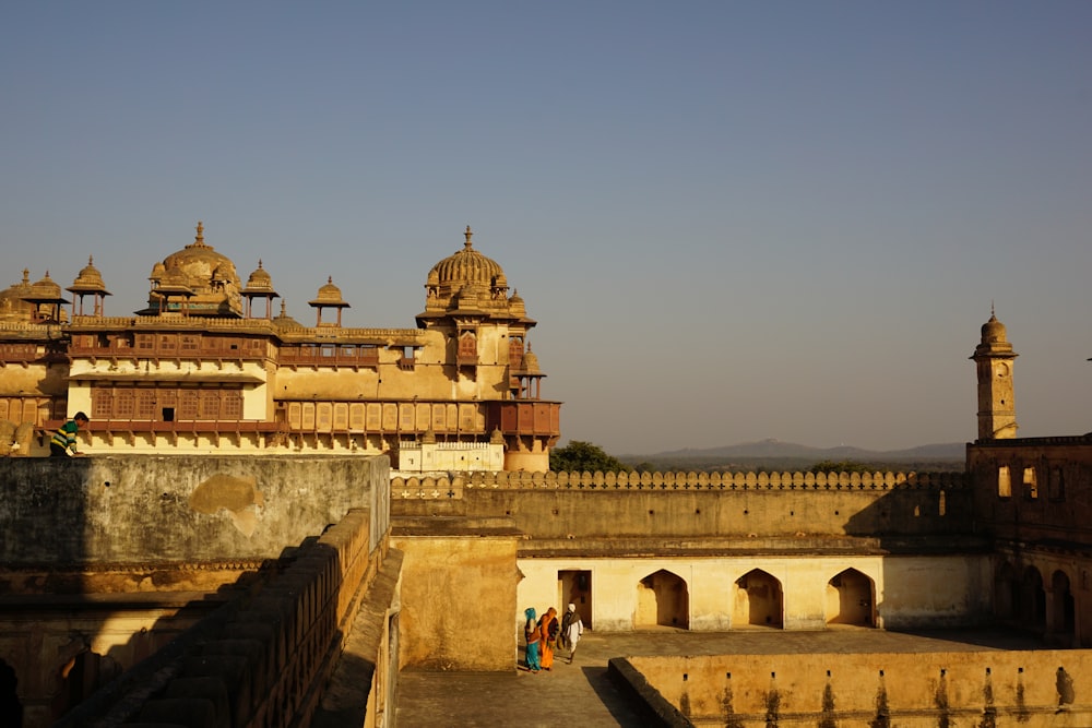 a large building with two towers and a clock tower