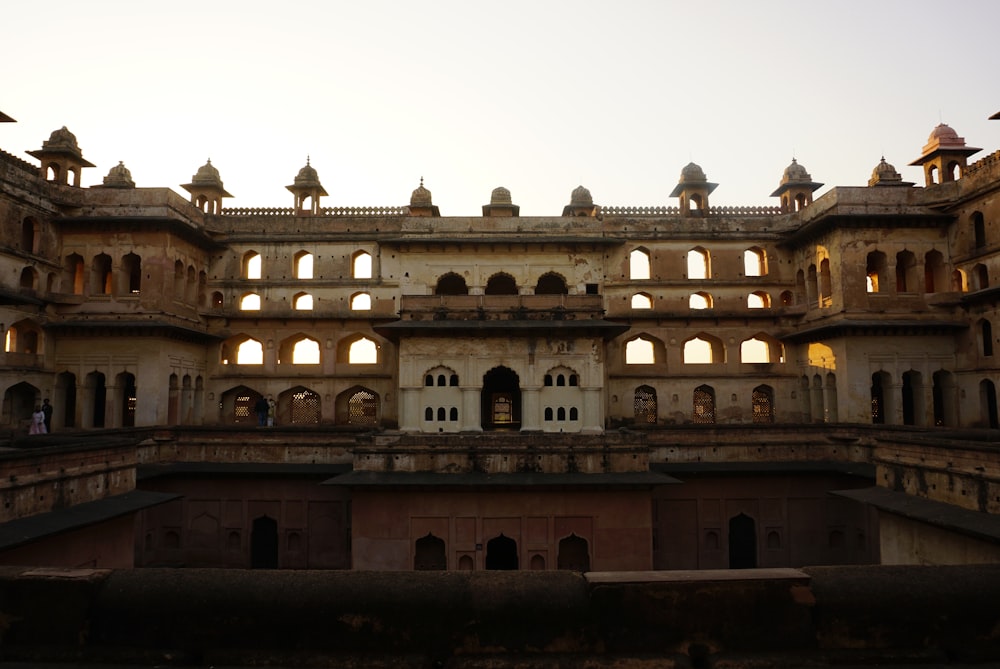 a large building with lots of windows and arches