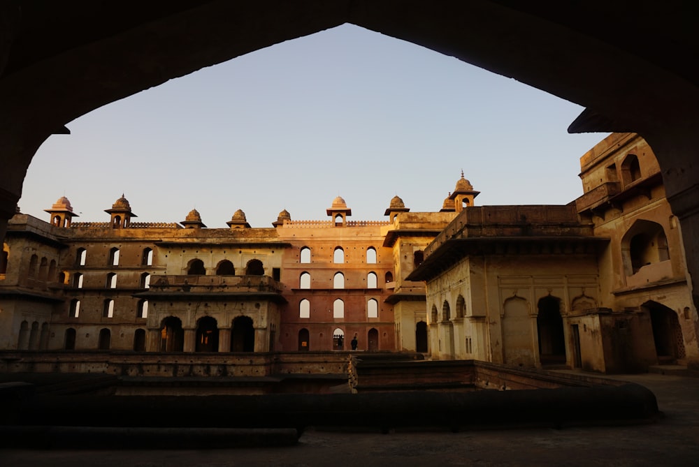 a large building with a fountain in front of it