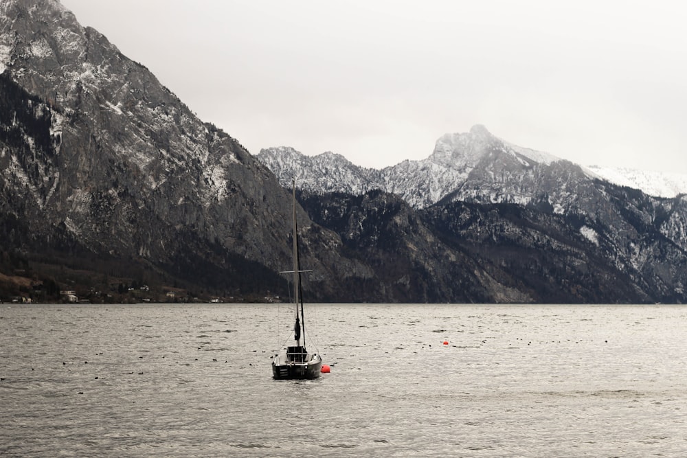 a boat floating on top of a large body of water