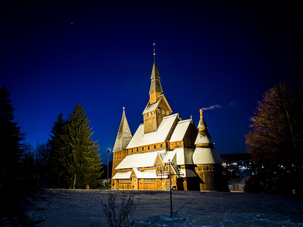 a church in the middle of winter with snow on the ground