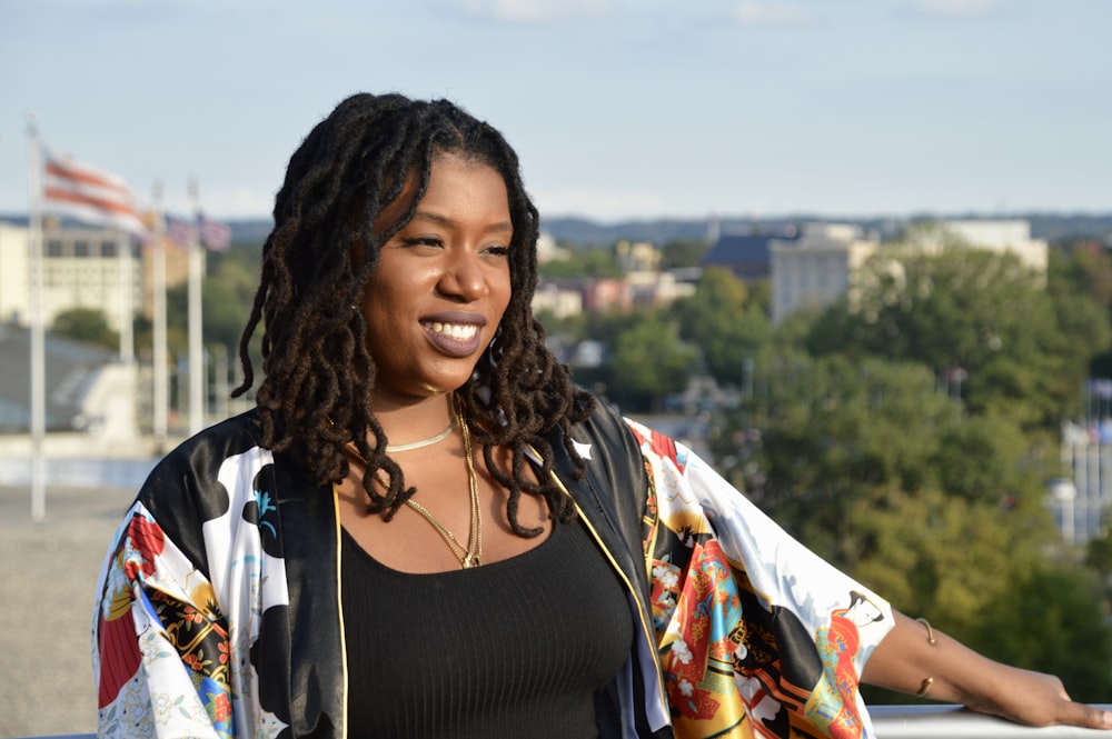 a woman standing on top of a roof