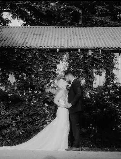 a black and white photo of a bride and groom