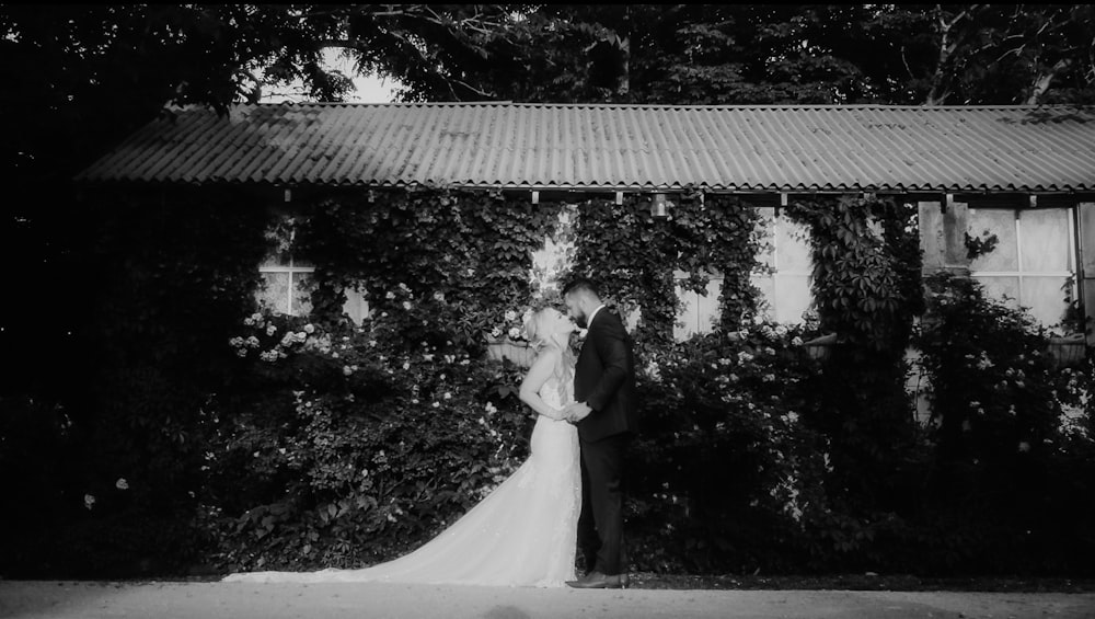 a black and white photo of a bride and groom