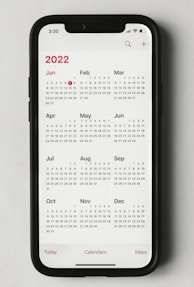 a phone with a calendar on the screen
