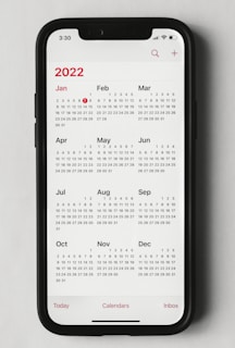 a phone with a calendar on the screen