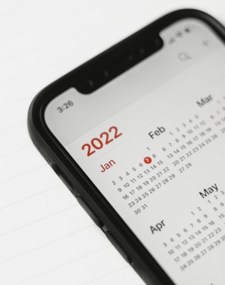 a cell phone with a calendar on the screen