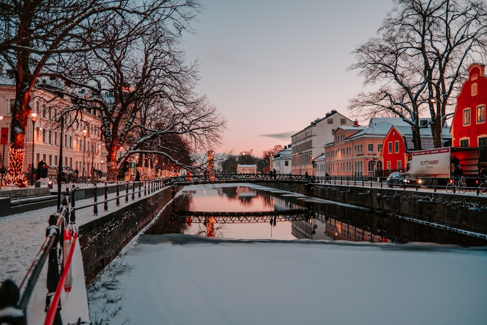 a river running through a snow covered city