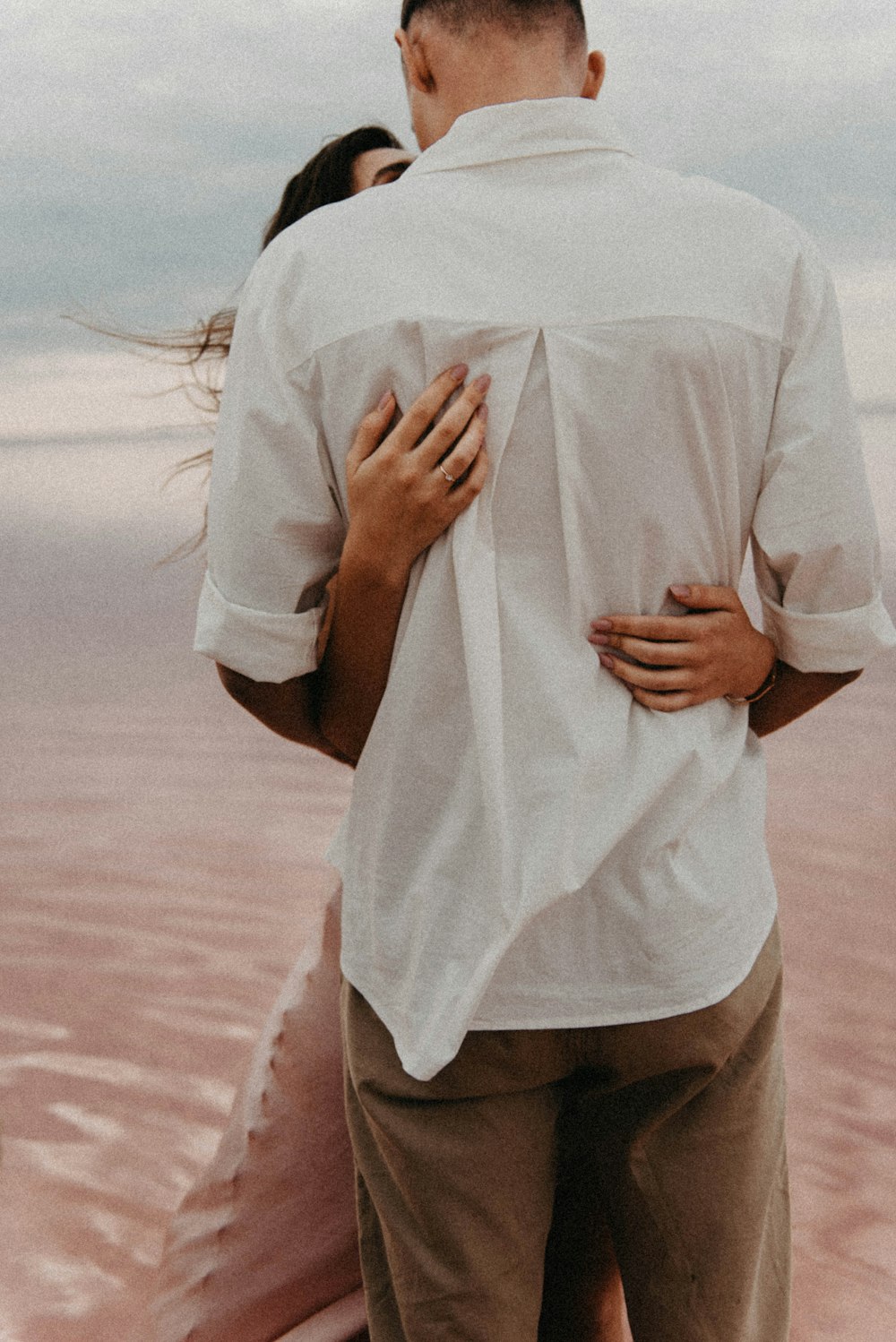 a man and a woman standing next to each other