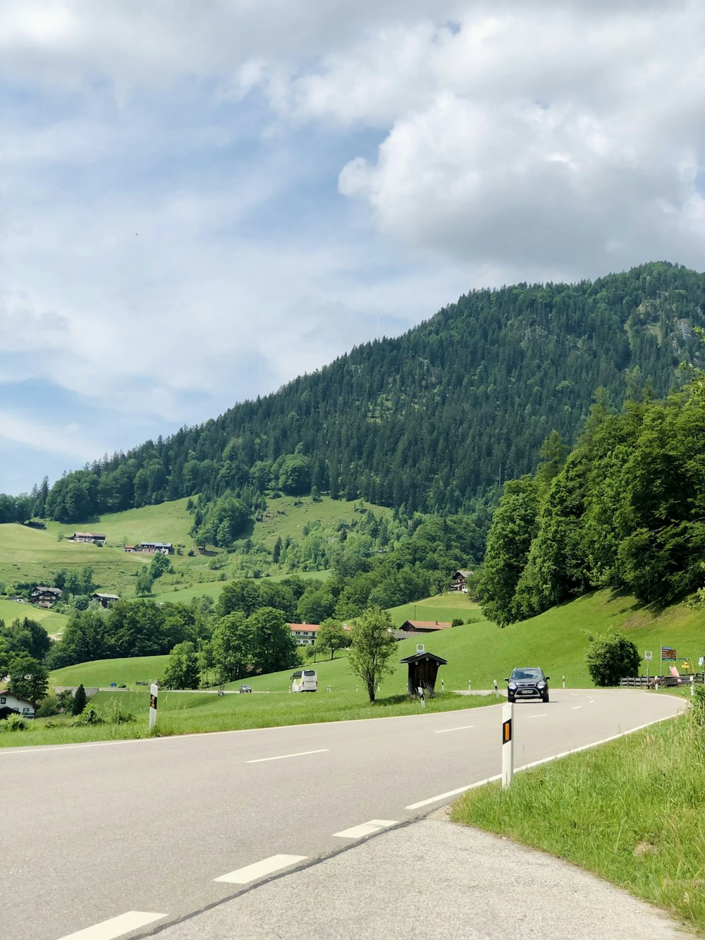 a view of a road with a mountain in the background