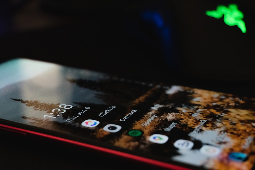 a close up of a cell phone on a table