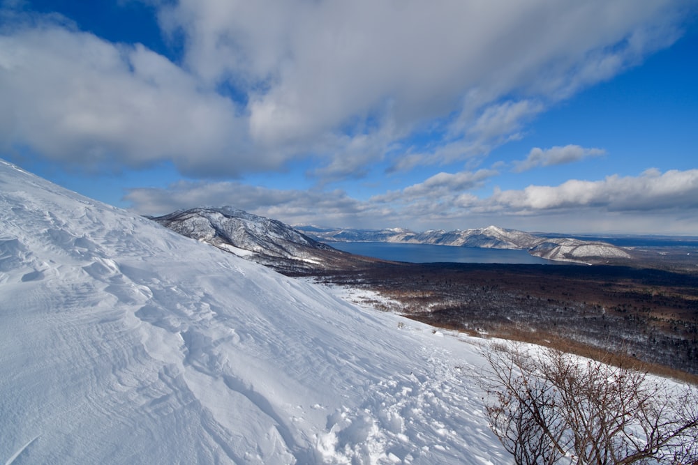 a snow covered mountain with a sky background