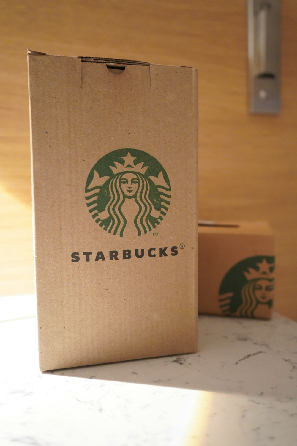 a starbucks bag sitting on top of a counter