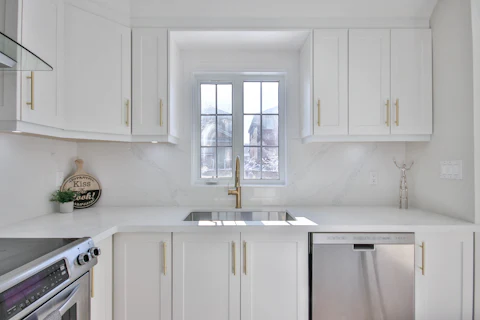 Built-in stainless steel dishwasher in a kitchen