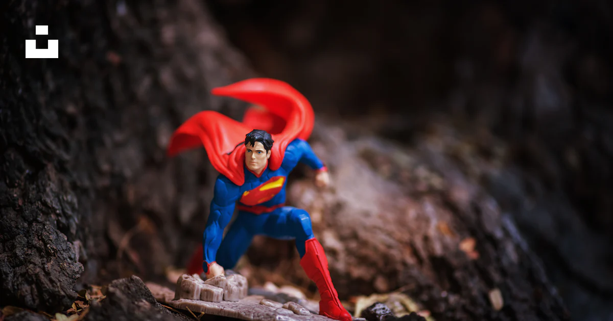 A superman action figure is posed on a rock photo – Free Filming Image ...