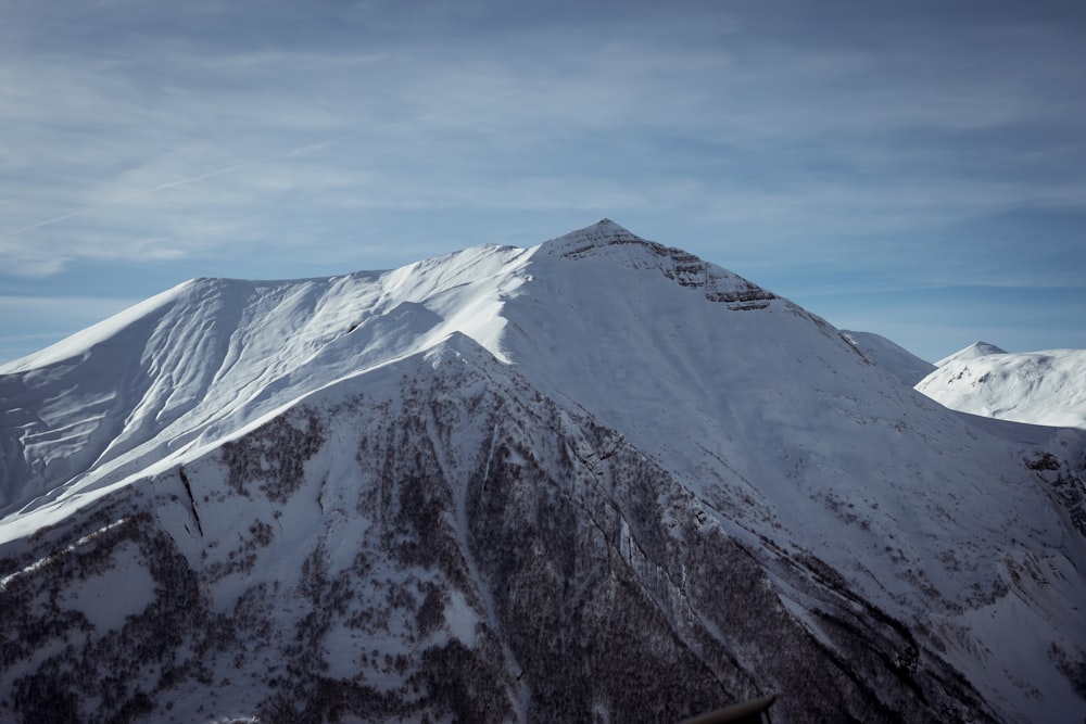 a snow covered mountain with a sky background