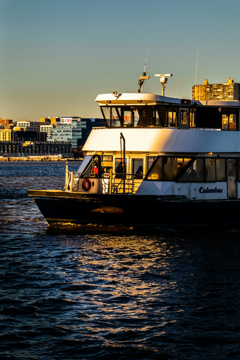 a large white boat floating on top of a body of water