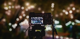 a camera with a cell phone attached to it