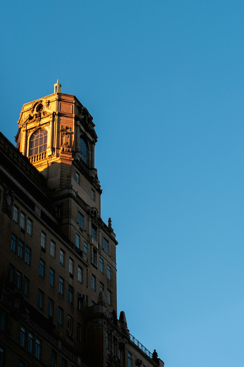 a tall building with a clock on the top of it