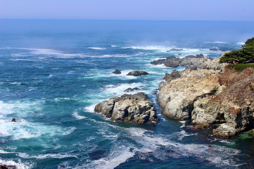 a view of the ocean from the top of a cliff