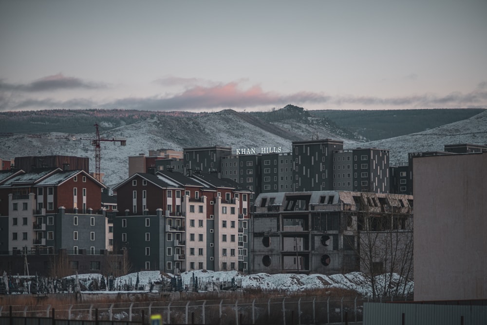 a view of a city with mountains in the background