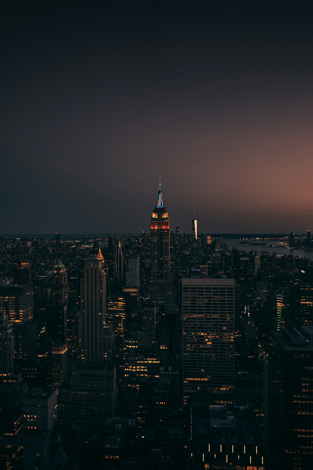 a view of a city at night from the top of a building