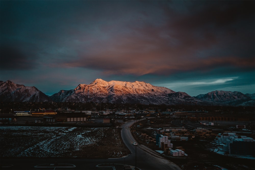 a view of a mountain range with a cloudy sky