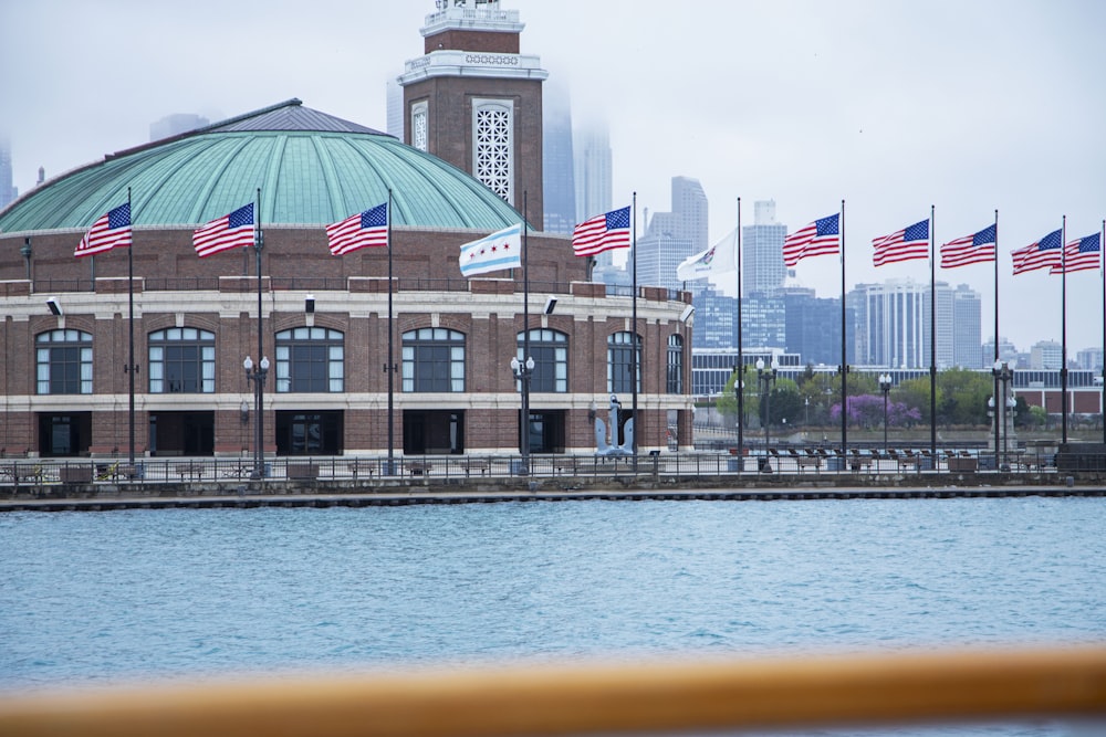 a large building with a lot of american flags in front of it