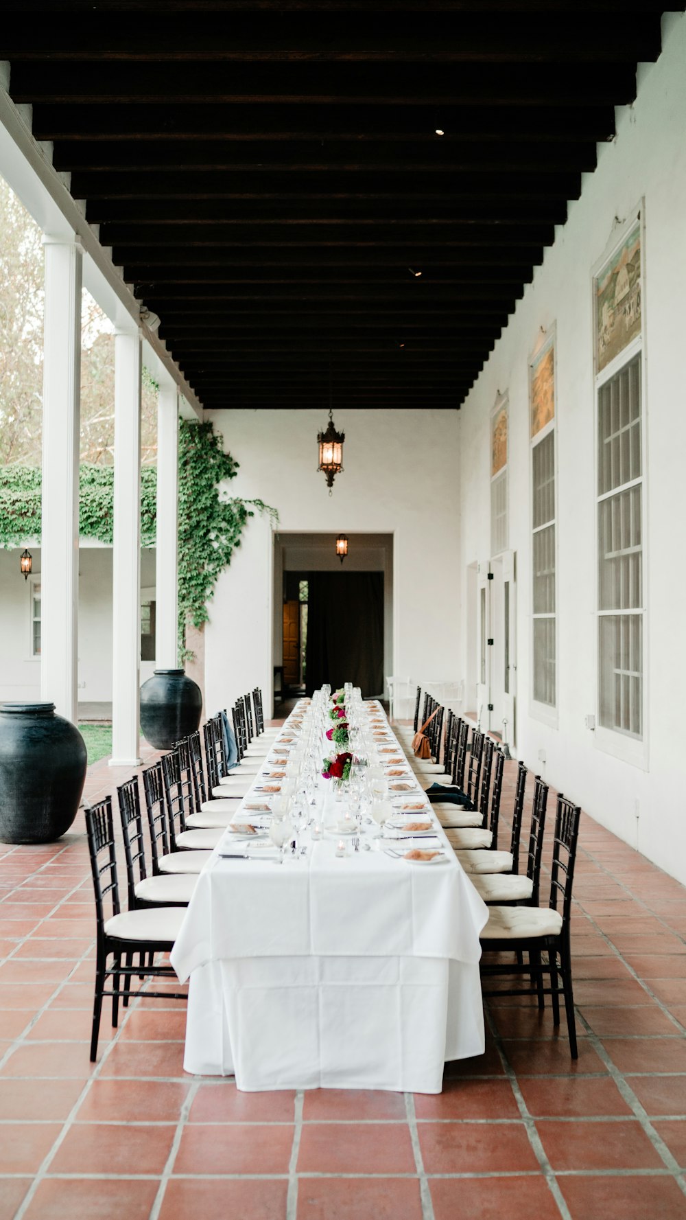 a long table set up for a formal dinner