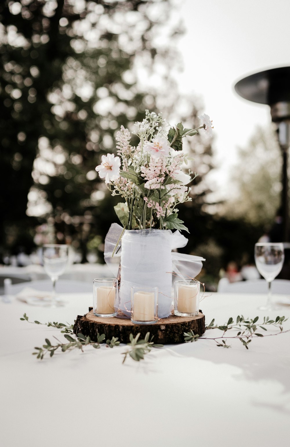 a vase filled with flowers sitting on top of a table