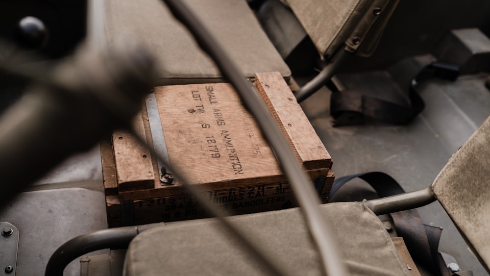 a wooden box sitting on top of a chair