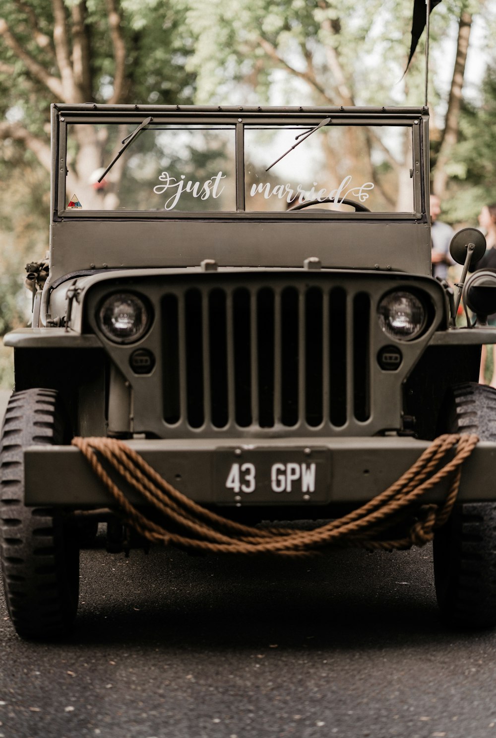 a military jeep is parked on the street