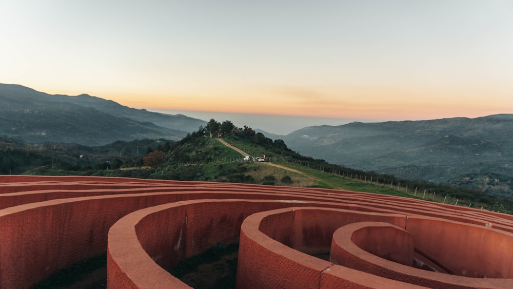 a view of a hill with a maze in the middle of it