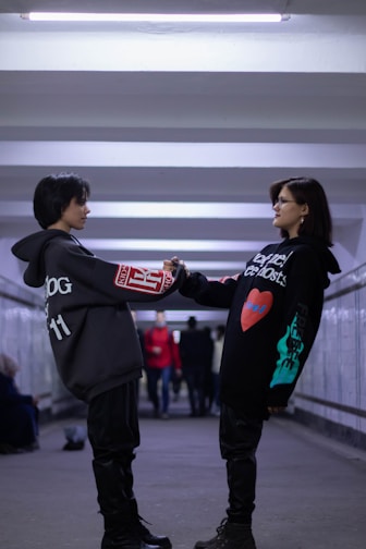 a couple of people standing next to each other