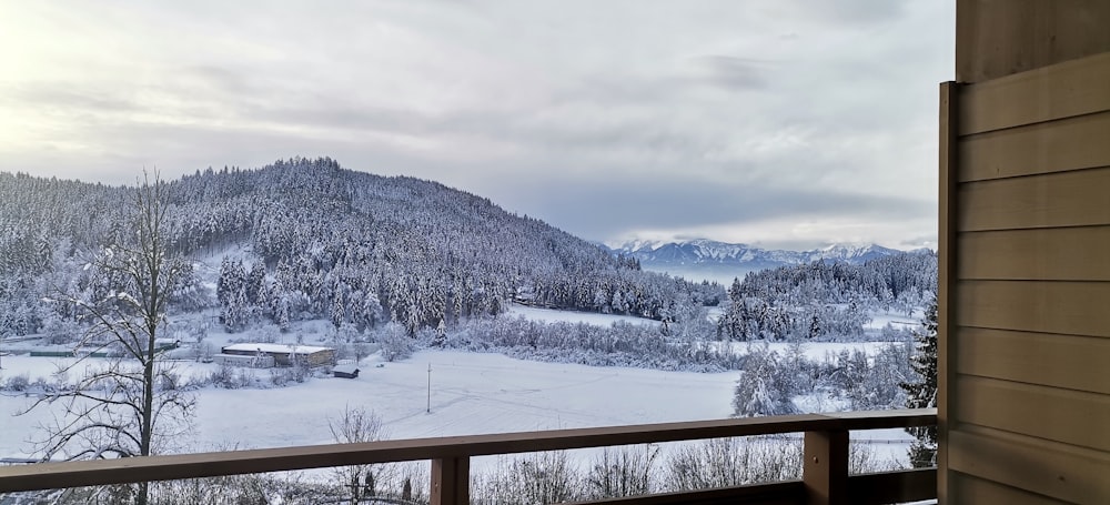 a balcony with a view of a snowy mountain