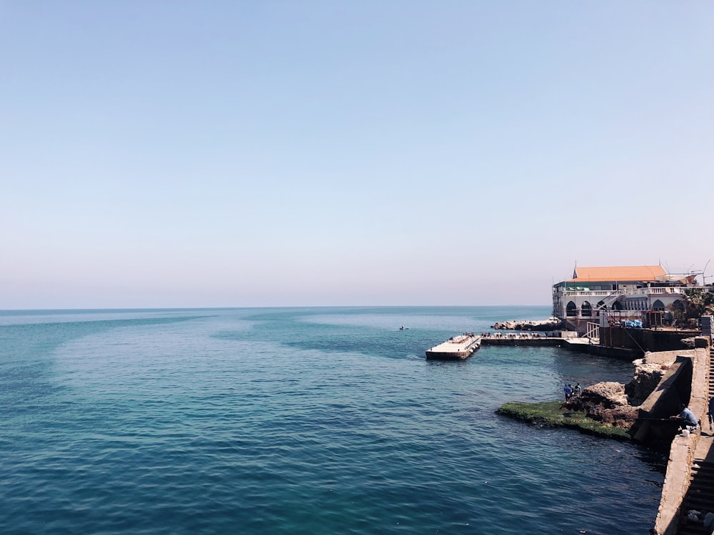 a body of water with a boat in the distance