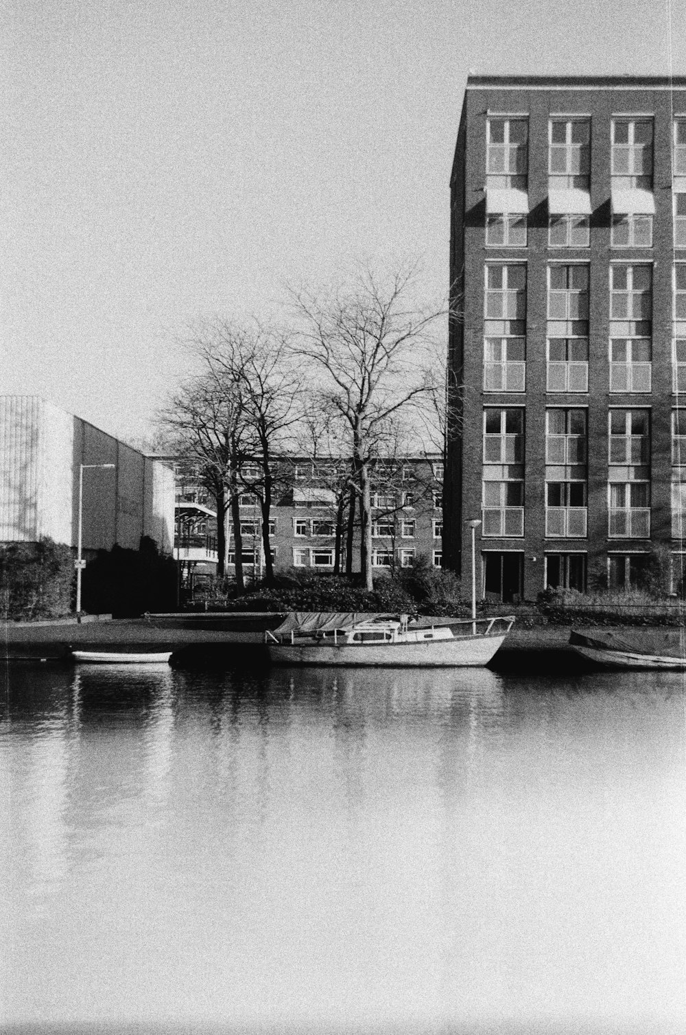 a black and white photo of a boat in the water