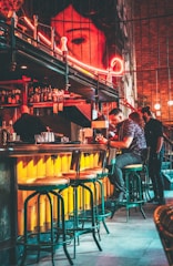 A stylish bar website with bold colors and event promotions.