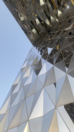 a close up of a building with a sky background