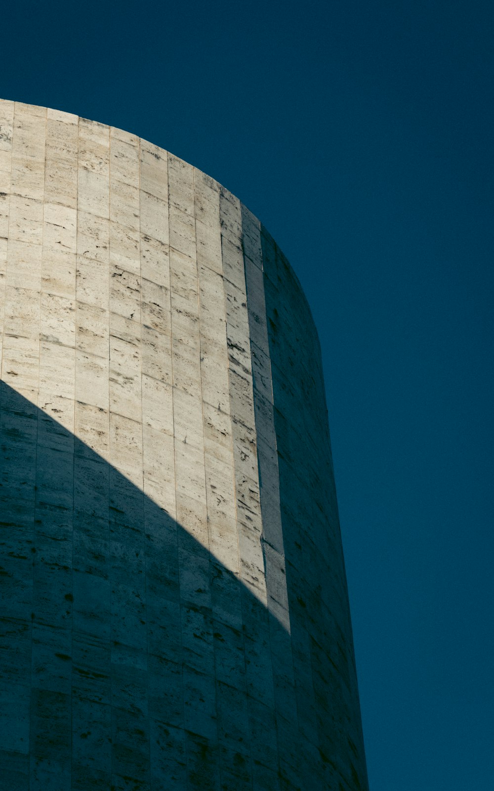 a tall building with a clock on the side of it