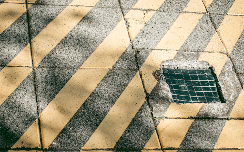a drain in the middle of a cross walk