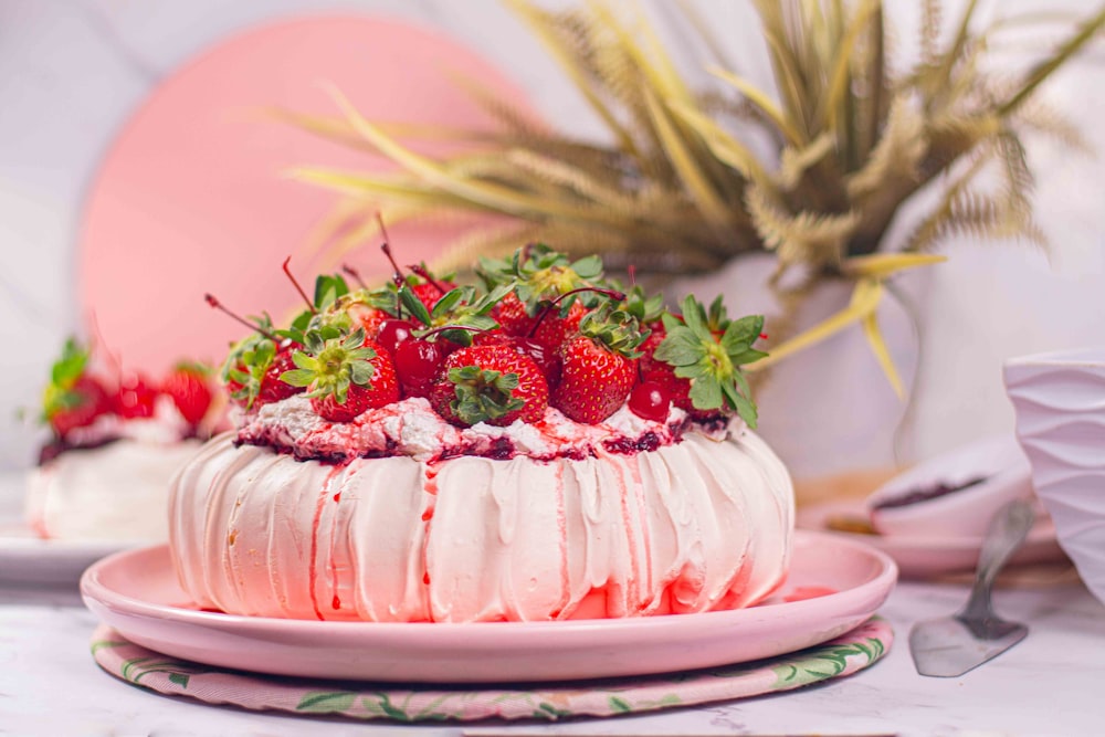 a white cake with strawberries on top of it