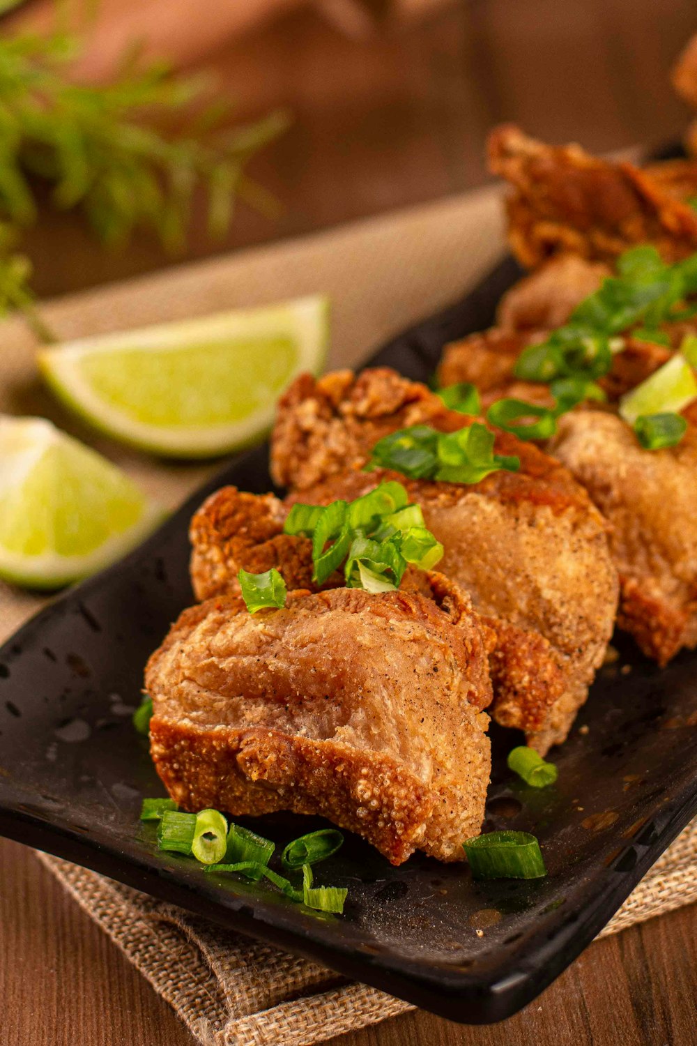 a plate of food on a table with limes