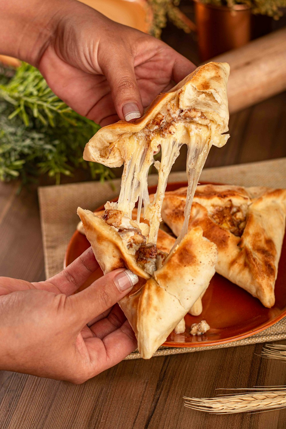 a slice of pizza being lifted from a plate