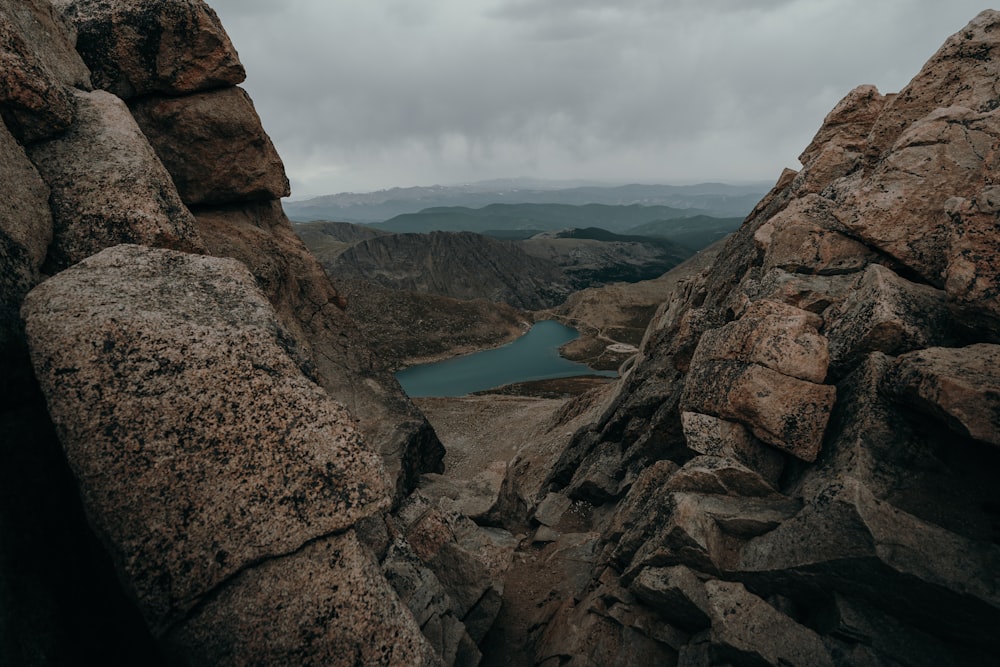 a view of a lake from a rocky outcropping