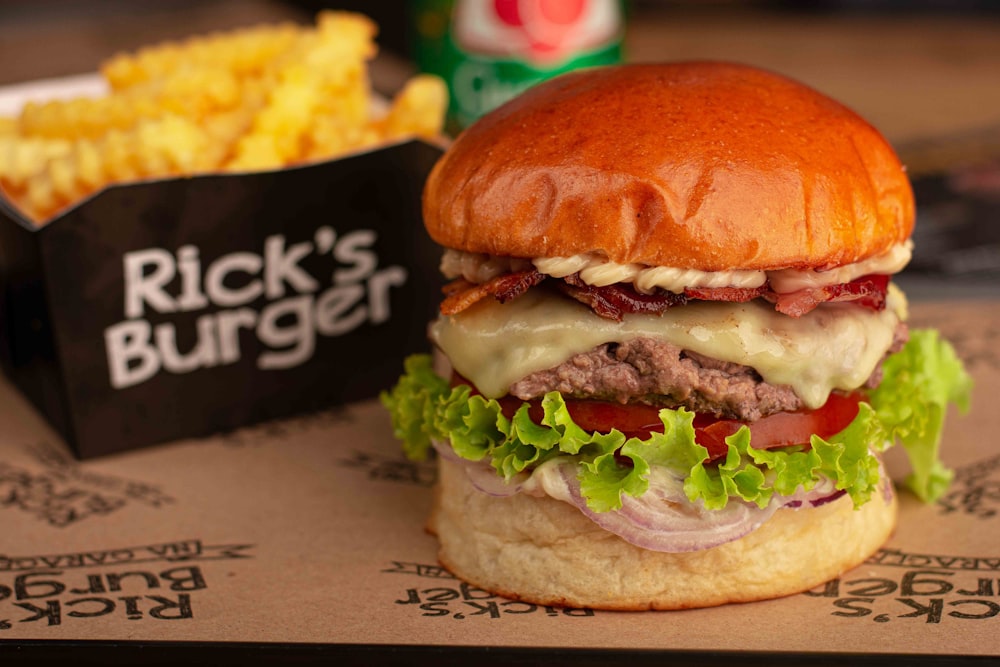 a hamburger and french fries on a tray