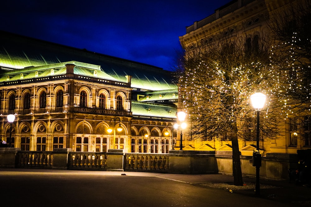 a large building lit up at night with lights