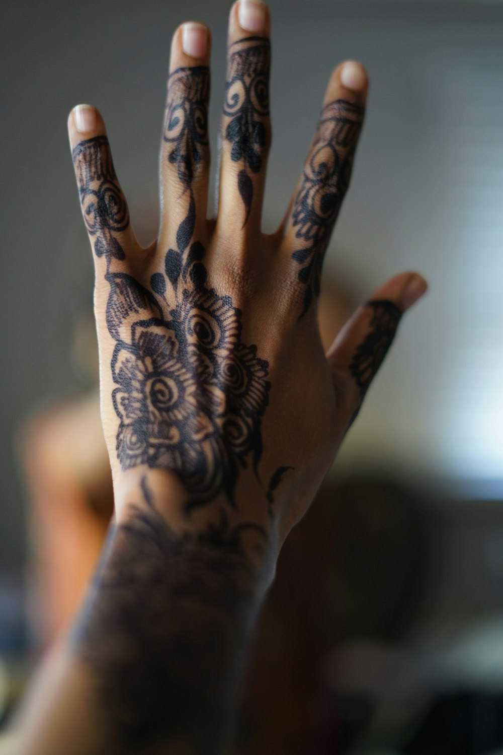 a person's hand with a tattoo on it